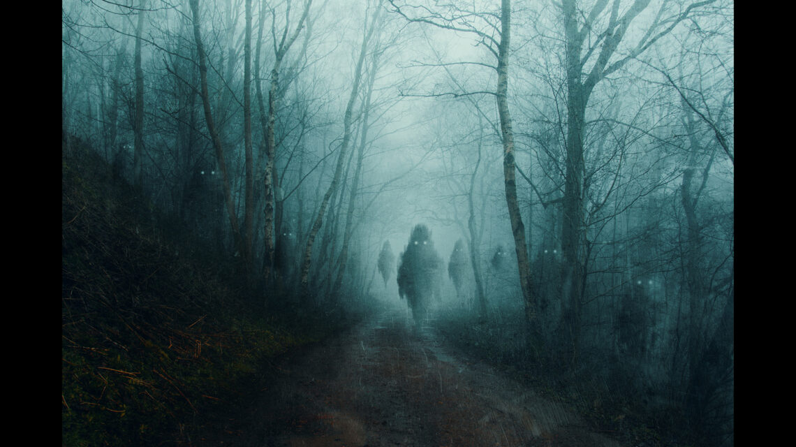 A horror concept of floating ghost monsters on a forest road, on a spooky, foggy winters evening. With a grunge, texture edit. Text at bottom reads "May you make many new friends this holiday season. Love, Nicola and Eights The Cat"